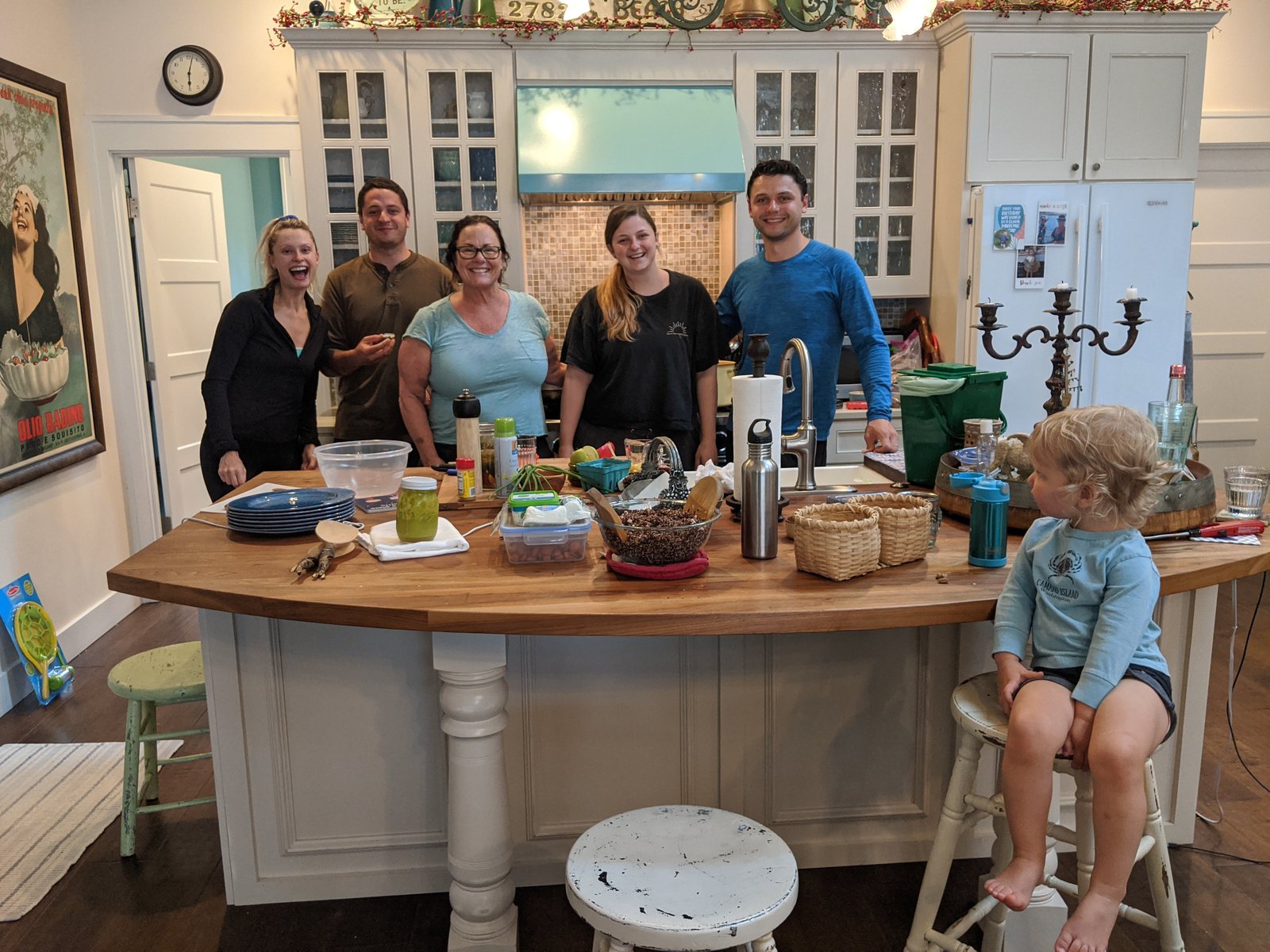 Family gathered in the beach house kitchen